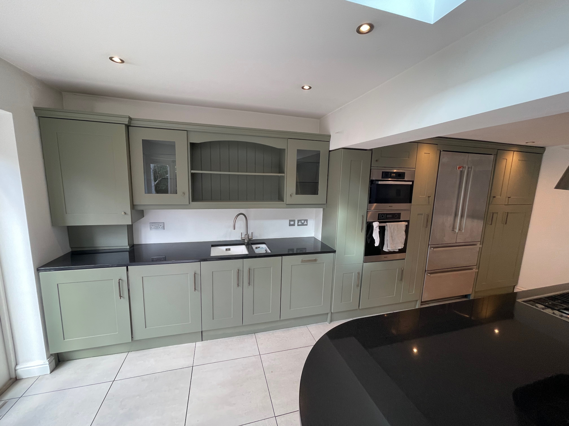 Sage green kitchen wide angle view