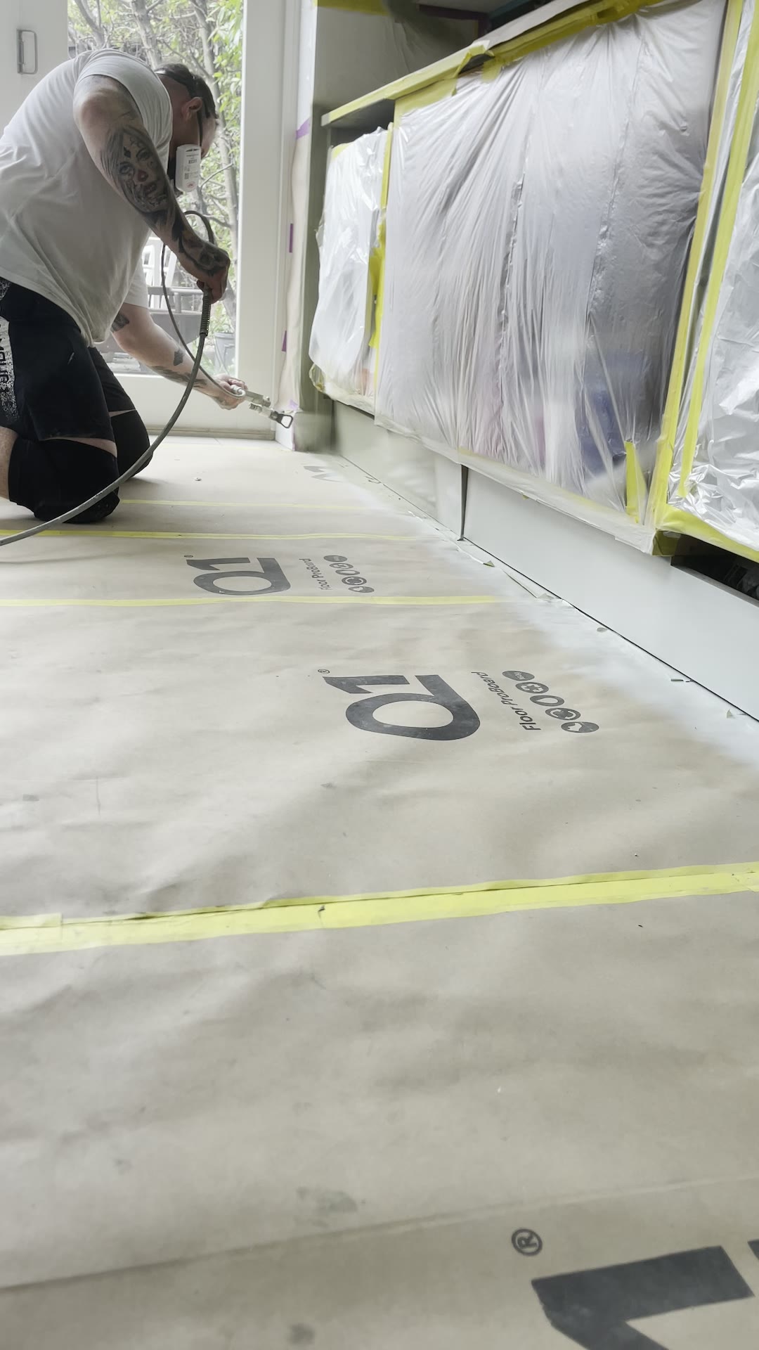 Base units masked and sprayed inside a lived-in London home