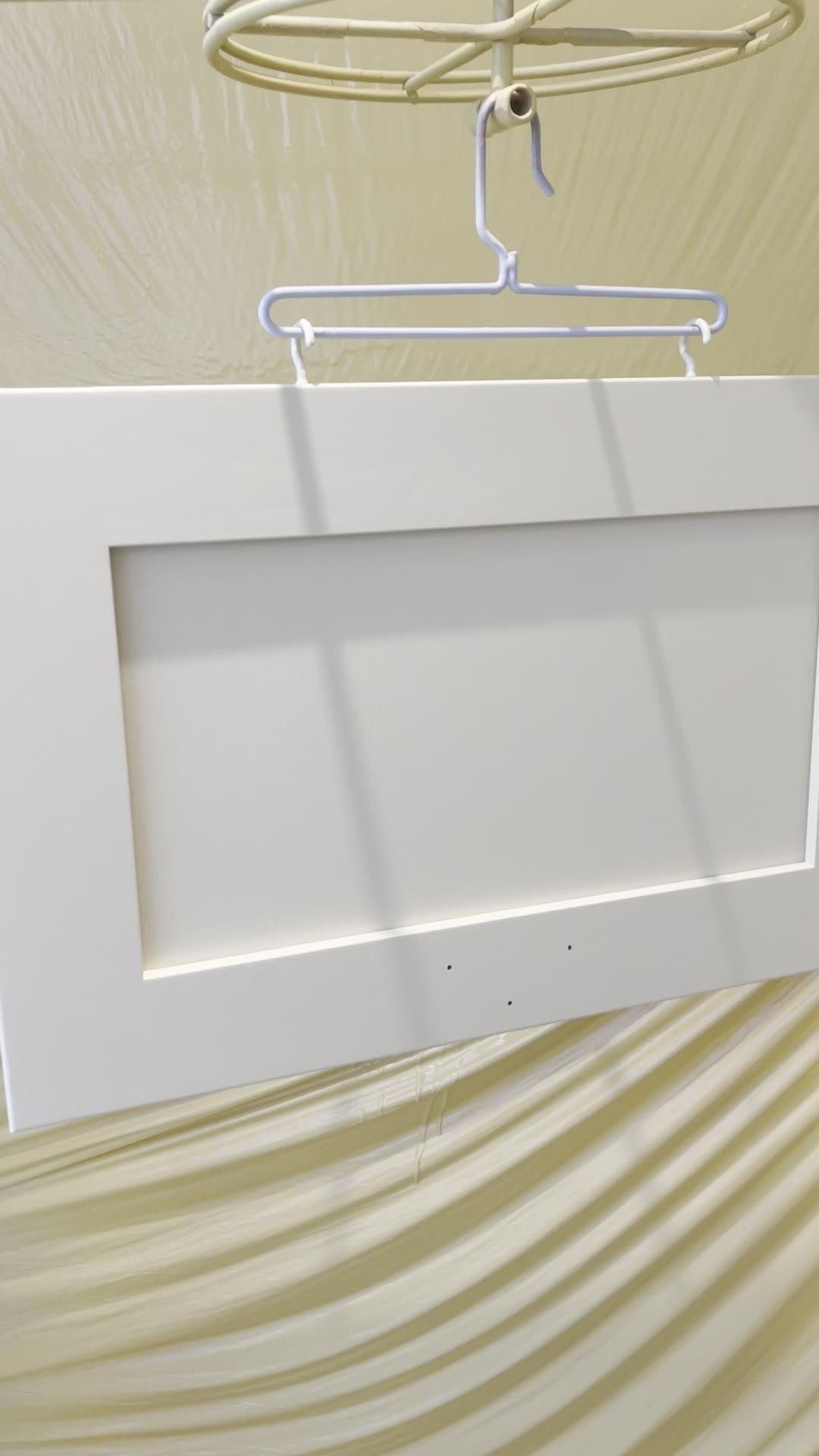Freshly sprayed white shaker kitchen door hanging to cure in a masked drying area